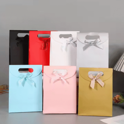 DE-LIANG High Quality Custom Printed logo Luxury Shopping Gift Paper Bags with Handbag and Bow for Clothing Shoes Cosmetic Packaging